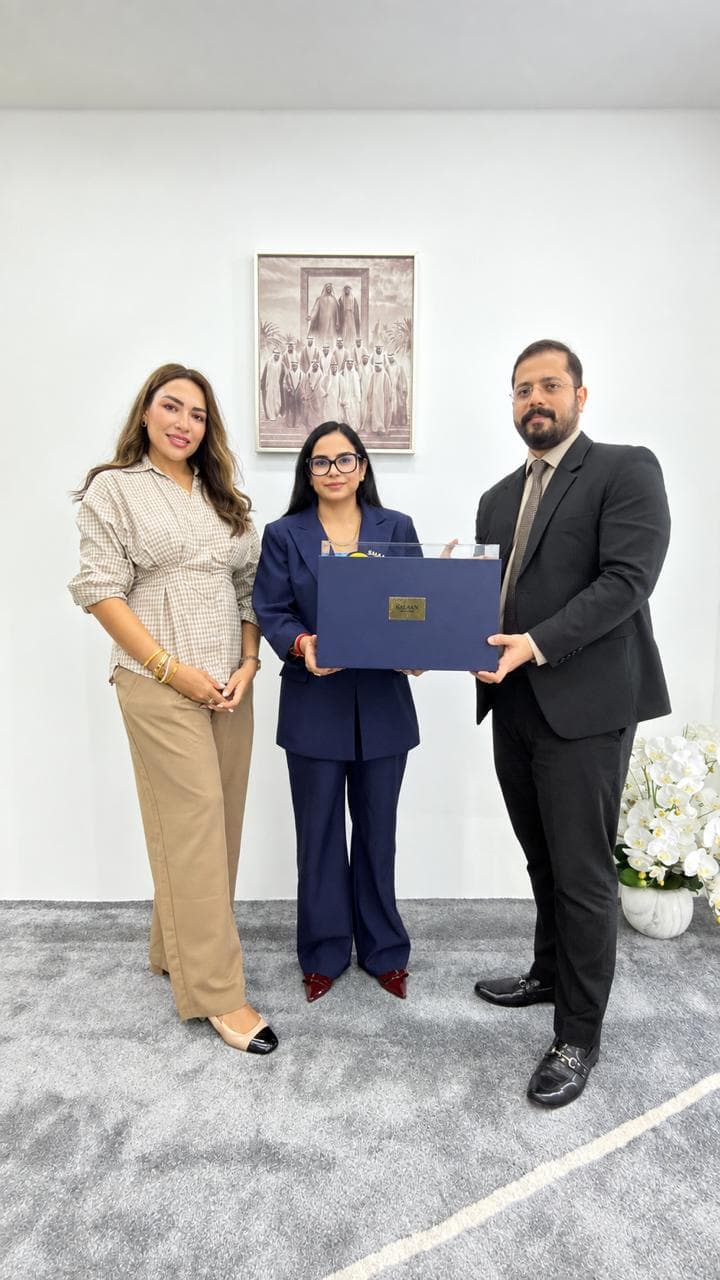 Visiting guests presenting a gift to First Key International at the Dubai office